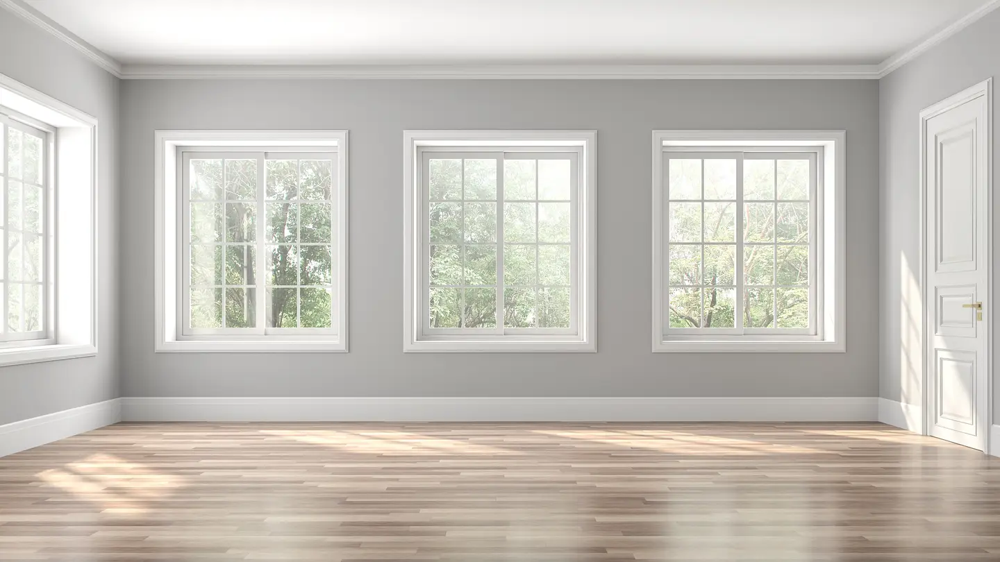 large open room with four windows and white trim