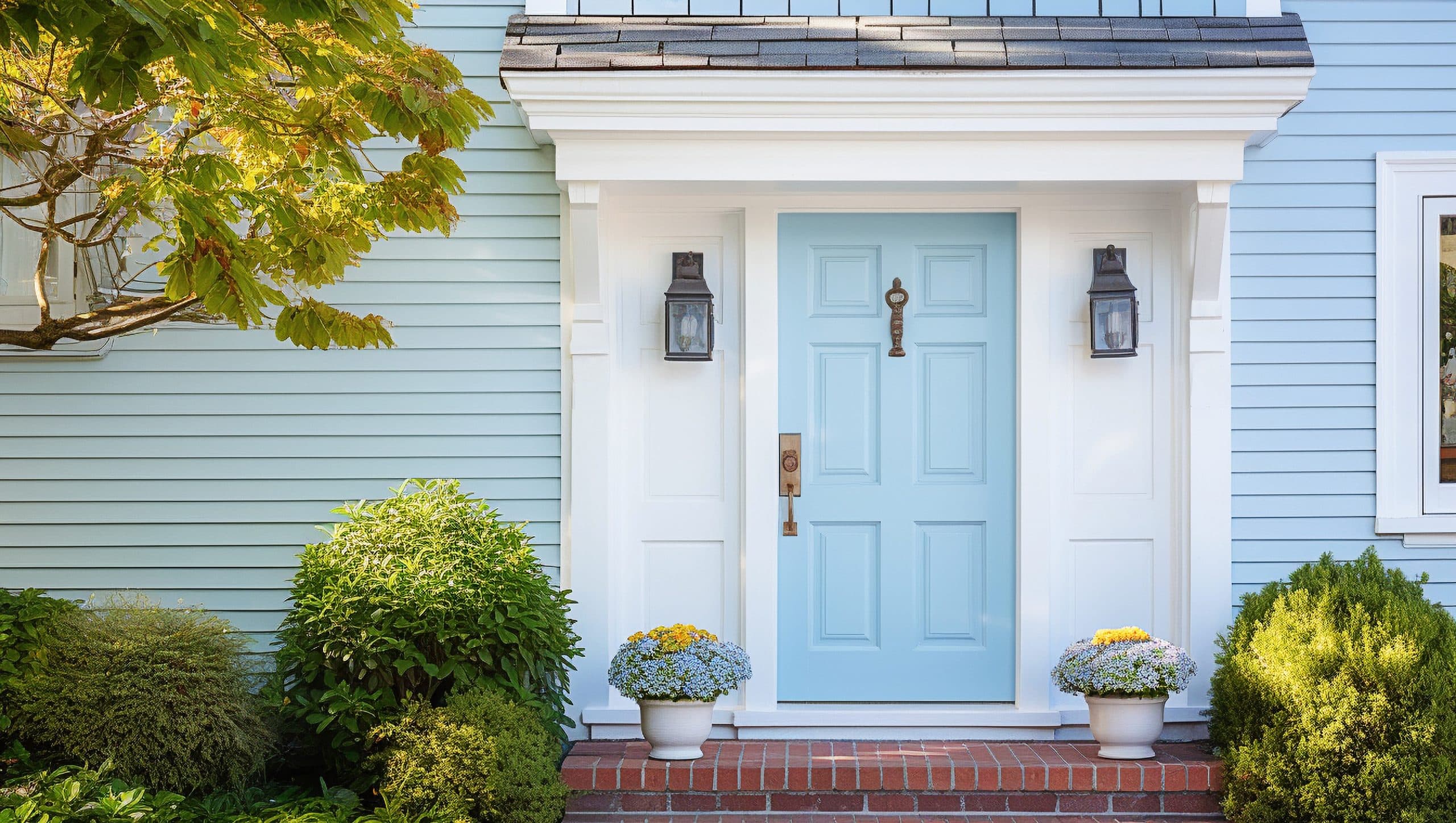 A beautiful baby blue entry door on a blue, St Johns, FL home for Jacksonville Doors & Windows